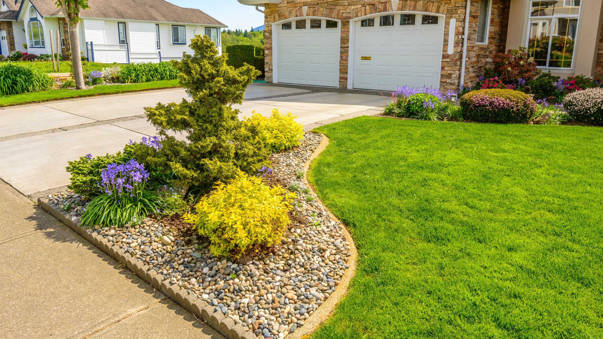 A rock topped landscape bed installed in front of our client's home in St. Clair, MN.